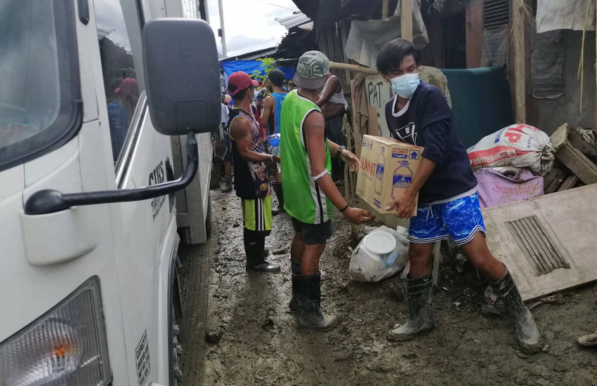Local partners distributing relief goods for typhoon Vamco in the Philippines