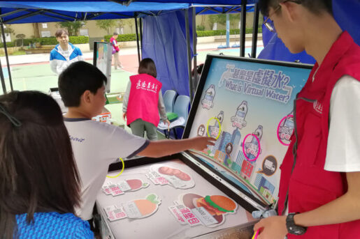 Students learning about responsible water consumption at game booths