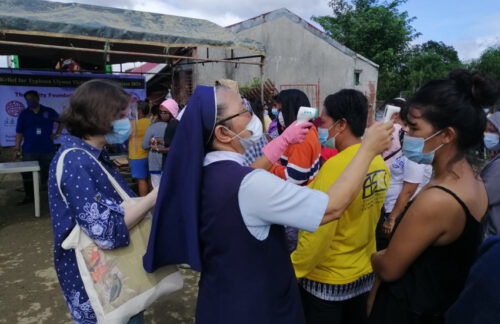 Local partners distributing relief goods for typhoon Vamco in the Philippines