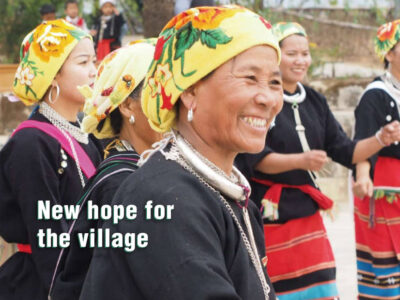 cover page of Amity Outlook, ethnic minority village women laughs
