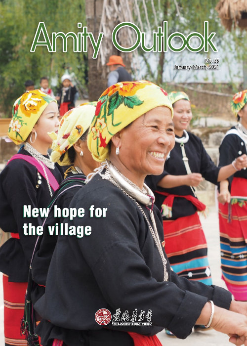cover page of Amity Outlook, ethnic minority village women laughs